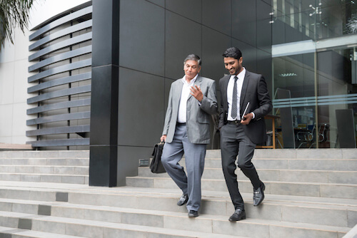 businessmen walking on stairs